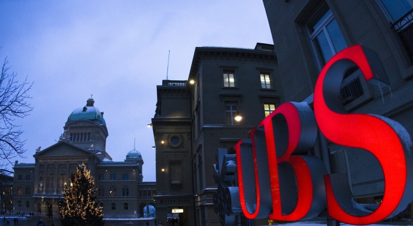 The logo of Swiss bank UBS in front of the Swiss Federal Palace in Bern. REUTERS Swiss bank UBS