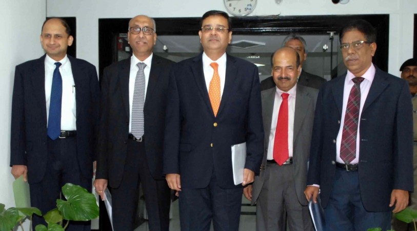 RBI deputy governor Dr Viral V Acharya (extreme left), along with governor Urjit Patel (third from left) during a press conference to announce the second bi-monthly monetary policy review of the fiscal, in Mumbai on June 7, 2017. , rbi, rbi list of 12 defaulters, rbi deputy governor viral acharya, bhushan steel, essar steel, lanco infra, alok industries, NPA ordinance, crackdown on bad loans