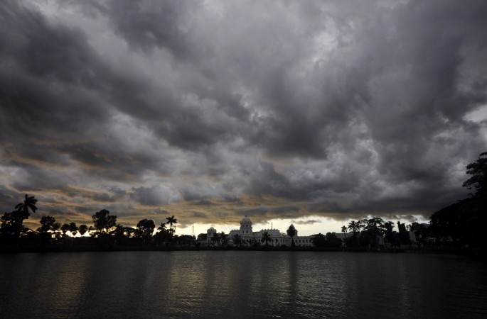 In this file photo monsoon storm clouds move over the royal palace in Agartala Monsoon