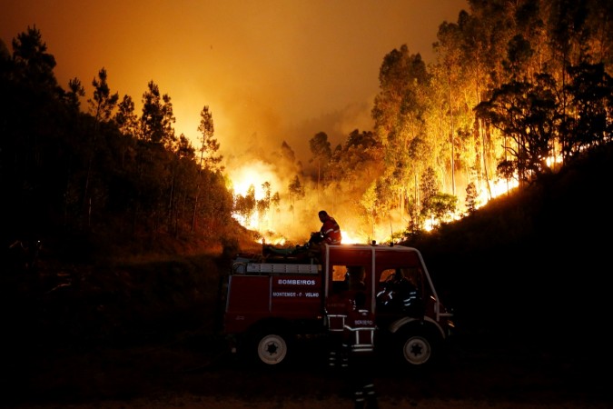 Firefighters work to put out a forest fire near Bouca, in central Portugal, June 18, 2017. Portugal Fire