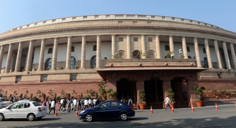 Visitors walk outside at the opening of the Winter session of Parliament in New Delhi on December 5, 2013. parliament, monsoon session, lok sabha, rajya sabha, gst, cattle, bjp, congress, pm modi, arun jaitley