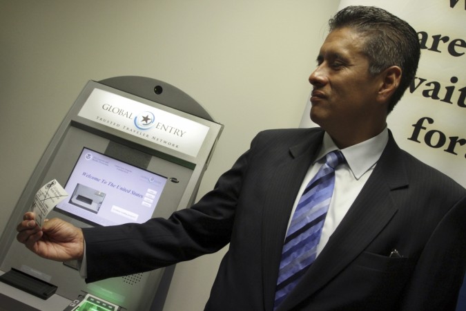 In picture: Steve Gomez, FBI Counter-Terrorism Division Los Angeles, Special Agent in Charge, holds a print out from a new Global Entry Kiosk at Los Angeles International Airport September 7, 2011, as part of new security enhancements in the 10 years following the 9/11 attacks. Global Entry kiosk