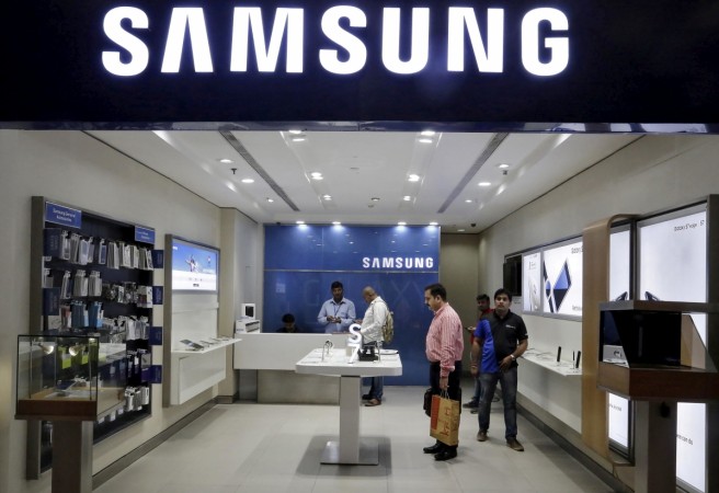 Customers shop at a Samsung mobile store inside a shopping mall in New Delhi Samsung