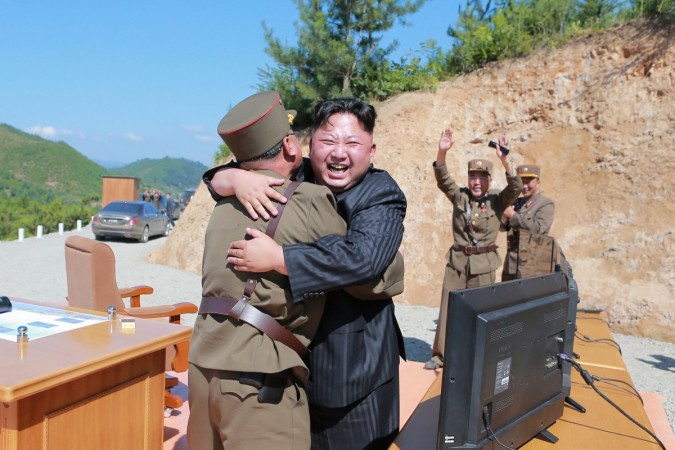 North Korean leader Kim Jong Un reacts with scientists and technicians of the DPRK Academy of Defence Science after the test-launch of the intercontinental ballistic missile Hwasong-14. The pariah state's nuclear ambitions have become a major threat to international peace. North Korean leader Kim Jong Un with scientists and technicians of the DPRK Academy of Defence Science