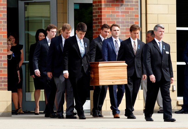 The casket of Otto Warmbier is carried to the hearse followed by his family and friends after a funeral service for Warmbier, who died after his release from North Korea, at Wyoming High School in Wyoming, Ohio, U.S. June 22, 2017. The casket of Otto Warmbier is carried to the hearse followed by his family and friends after a funeral service