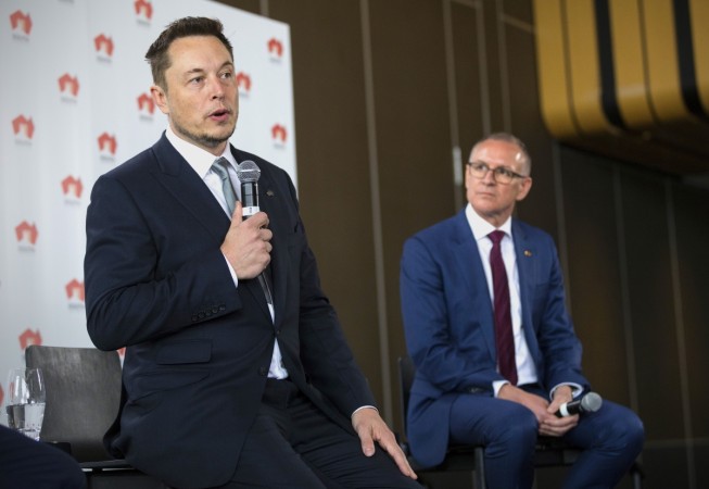 South Australian Premier Jay Weatherill (R) listens to Tesla Chief Executive Officer Elon Musk speak during an official ceremony in Adelaide, Australia, July 7, 2017. Elon Musk, Tesla, South Australia, battery,
