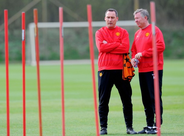 Manchester United manager Sir Alex Ferguson (R) and coach Rene Meulensteen watch a training session at the Carrington training ground in Manchester. Date: April 6, 2009. manchester united, rene meulensteen