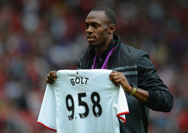 File photo of Usain Bolt posing with a Manchester United shirt Usain Bolt