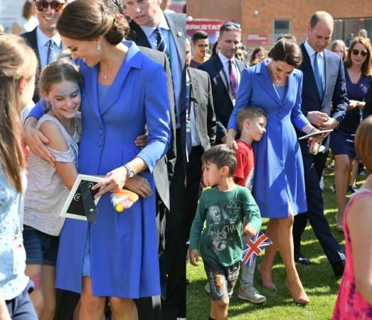 The Duchess of Cambridge hugs kids in Berlin kate middleton dresses