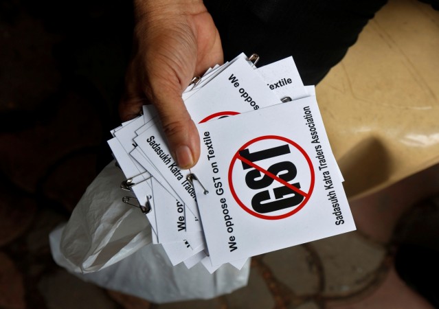 MILES TO GO: Ban messages were featured in an anti-GST march protesting implementation of the Goods and Services Tax (GST) on textiles in Kolkata. REUTERS/Rupak De Chowdhuri GST protests