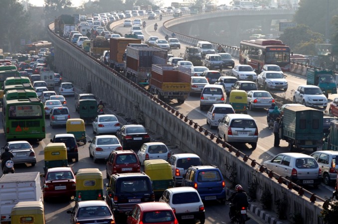 Traffic moves along a busy road in New Delhi January 11, 2011. Vehicular traffic in India