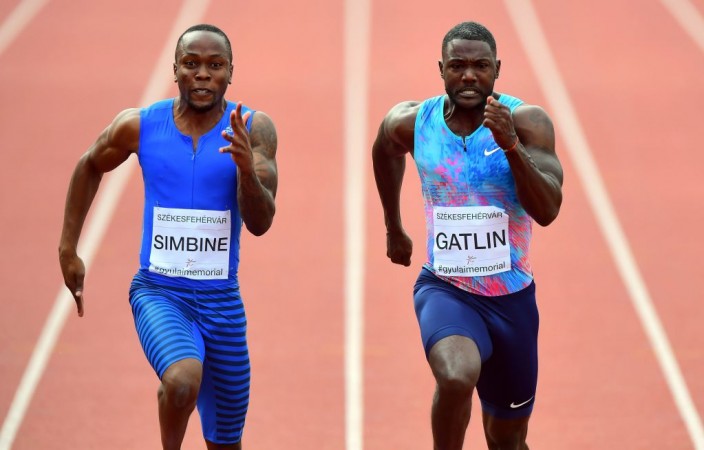 Akani Simbine and Justin Gatlin (R) Akani Simbine