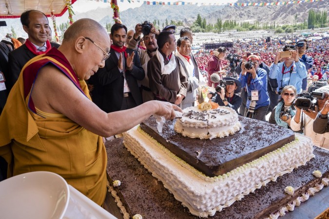 In picture: The Dalai Lama cuts his birthday cake during celebrations in honour of his 82nd birthday in Leh, Ladakh, on July 6, 2017. Dalai Lama