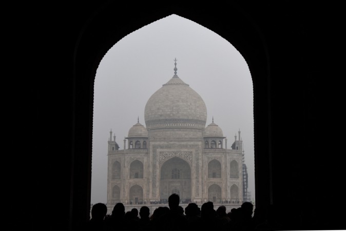 Tourists walk through an archway during their visit to the Taj Mahal monument in the Indian city of Agra on January 7, 2017. Taj Mahal