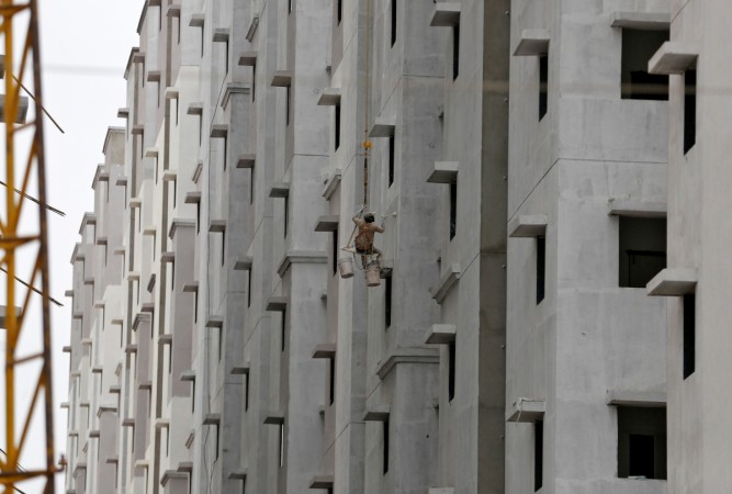 A housing project under construction. The new GST regime seeks to bring relief to both buyers and builders by lowering the tax rates as also allowing them to choose what rates to apply. Real estate