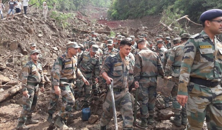 In picture: Indian Army personnel aid in search and rescue work after a landslide killed at least 46 people in Himachal Pradesh. Indian Army