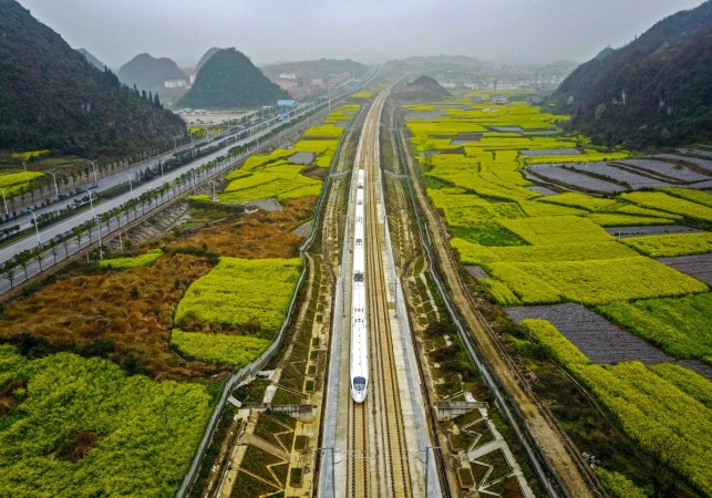 This aerial photo taken on March 16, 2017 shows a high-speed train traveling on the railway in Anshun, southwest China's Guizhou province. China bullet train