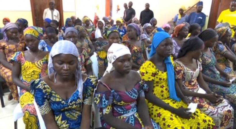 In picture: A still image taken from video shows a group of girls, released by Boko Haram jihadists after kidnapping them in 2014 in the north Nigerian town of Chibok, sitting in a hall as they are welcomed by officials in Abuja, Nigeria, May 7, 2017. Boko Haram