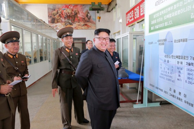 North Korean leader Kim Jong-Un smiles during a visit to the Chemical Material Institute of the Academy of Defense Science in this undated photo released by North Korea's Korean Central News Agency (KCNA) in Pyongyang on August 23, 2017. North Korea