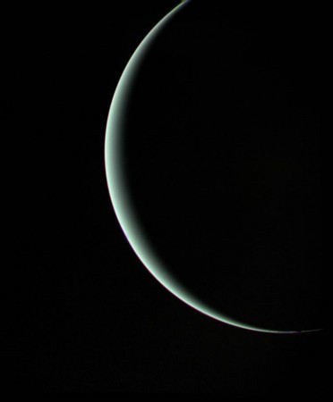 This view of Uranus was recorded by Voyager 2 on Jan 25, 1986, as the spacecraft left the planet behind and set forth on the cruise to Neptune Even at this extreme angle, Uranus retains the pale blue-green color seen by ground-based astronomers and recorded by Voyager during its historic encounter. Uranus, diamond rains, ice giant, SLAC,