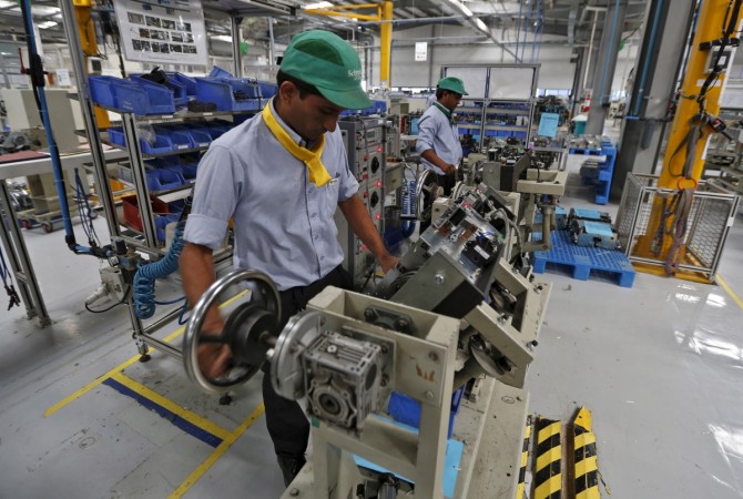 Employees assemble switchgears inside a Schneider Electric Infrastructure Ltd. plant on the outskirts of Vadodara in this file photo. REUTERS/Amit Dave Manufacturing