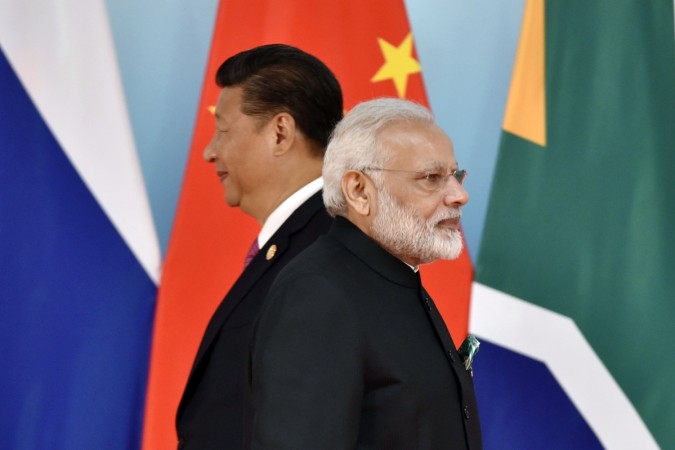 Chinese President Xi Jinping (L) and Indian Prime Minister Narendra Modi attend the group photo session during the BRICS Summit at the Xiamen International Conference and Exhibition Center in Xiamen, southeastern China's Fujian Province on September 4, 2017. Xi opened the annual summit of BRICS leaders that already has been upstaged by North Korea's latest nuclear weapons provocation. Modi Xi