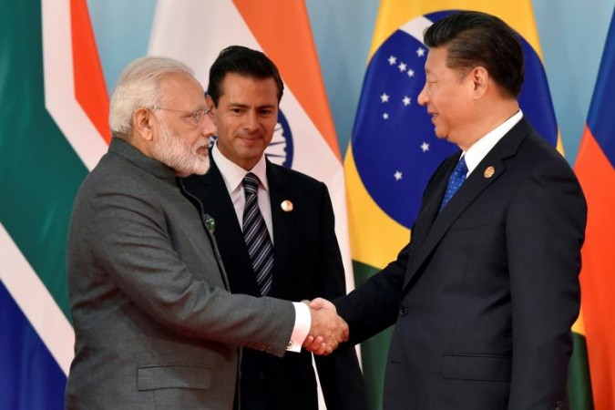 Chinese President Xi Jinping (R) and Prime Minister Narendra Modi (L) have met for an informal meeting in Wuhan, China. Modi Xi meeting