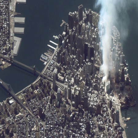 A satellite image captured on September 12, 2001, shows an area of white dust and smoke at the location where the World Trade Center towers once stood in New York City. Terrorists flew two hijacked airliners into the twin towers on September 11, killing over 3,000 people. World Trade Center attack