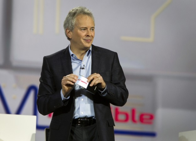 Brian Berkeley, senior vice president for Samsung's San Jose Display Lab, holds a prototype device with a flexible OLED screen during a keynote address at the Consumer Electronics Show (CES) in Las Vegas January 9, 2013. Samsung flexible display