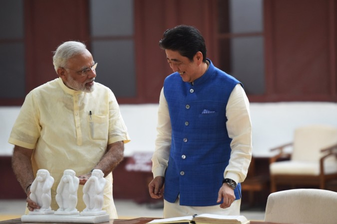 Japanese Prime Minister Shinzo Abe (C) and Indian Prime Minister Narendra Modi visit Sabarmati Ashram, in Ahmedabad on September 13, 2017. Narendra Modi Shinzo Abe