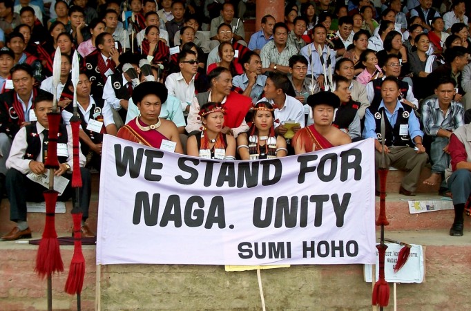 Naga tribesmen sit after a march in Kohima, the capital of the northeastern Indian state of Nagaland. Nagaland