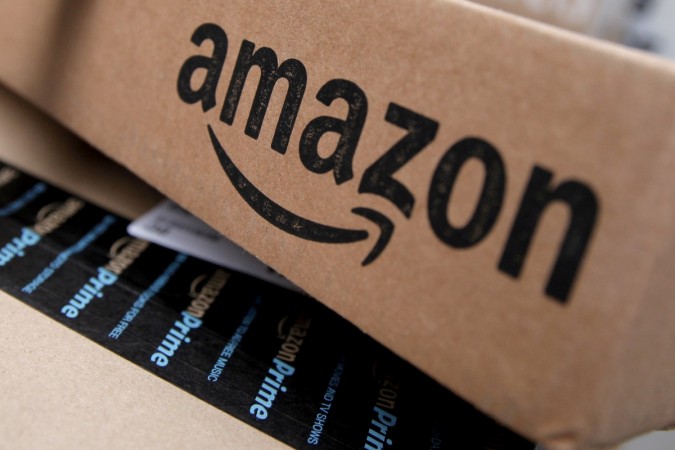 Amazon boxes are seen stacked for delivery. Amazon