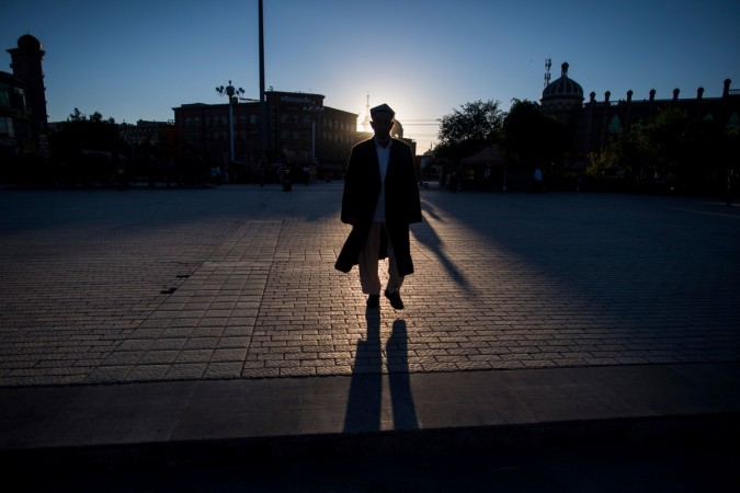 A Muslim man arrives at the Id Kah Mosque for the morning prayer on Eid al-Fitr in the old town of Kashgar in China's Xinjiang Uighur Autonomous Region China Muslims