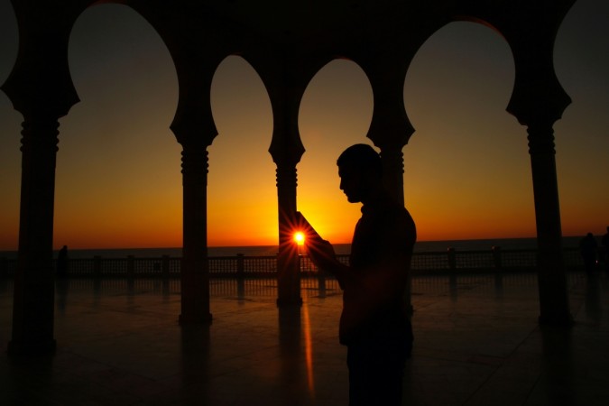A man reads from the Koran, Islam's holiest book, during the holy Muslim fasting month of Ramadan Quran