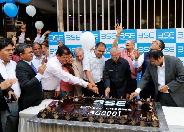 Employees of the Bombay Stock Exchange (BSE) cut a cake outside the building to celebrate the Sensex index rising to over 30,000, in Mumbai in this April 26, 2017 file photo. REUTERS/Shailesh Andrade BSE