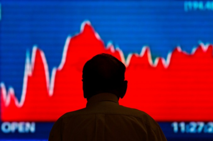 A man looks at a screen displaying market updates inside the Bombay Stock Exchange (BSE) building in Mumbai. REUTERS/Danish Siddiqui BSE