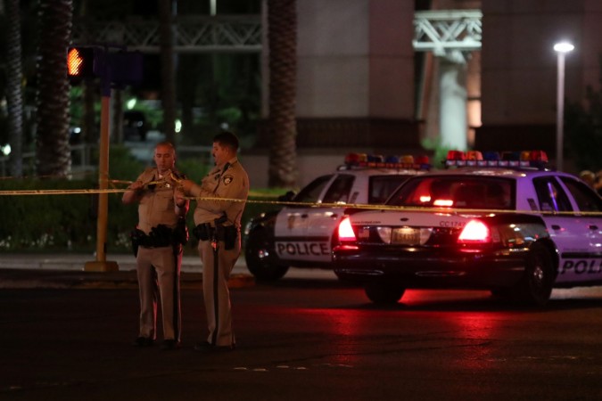 Police continue to keep a section of Las Vegas Boulevard closed as they work the crime scene following a mass shooting Las Vegas shooting
