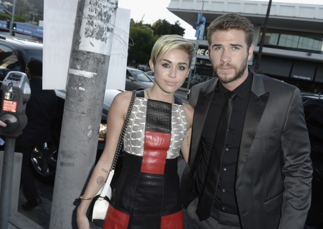 Miley Cyrus and Liam Hemsworth at the Paranoia premiere. miley