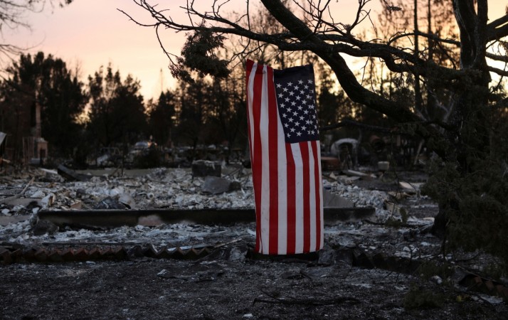 In picture: An American flag hangs from a tree in a neighbourhood destroyed by wildfire in Santa Rosa, California, US, October 12, 2017. California wildfires
