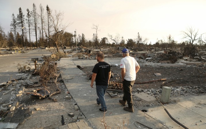 In picture: Area residents walk through a neighbourhood destroyed by wildfire in Santa Rosa, California, US, October 12, 2017. California wildfires