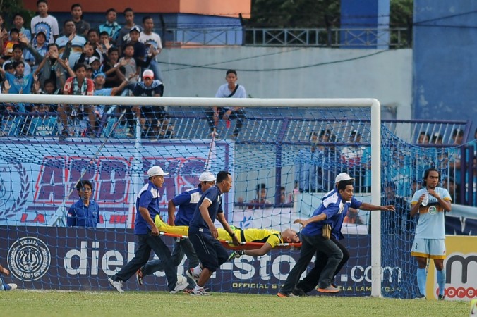 Goalkeeper Choirul Huda of hometown club Persela in East Java being rushed away on a stretcher and taken to hospital after colliding with Brazilian midfielder Ramon Rodrigues during a match at Surajaya Lamongan stadium in Surabaya. Indonesian football was in mourning after celebrated goalkeeper Choirul Huda died following an on-pitch collision with a team-mate. Huda, 38, a long-time regular for his hometown club Persela in East Java, collapsed just before half-time after Sunday's accidental clash with Brazilian midfielder Ramon Rodrigues choirul huda