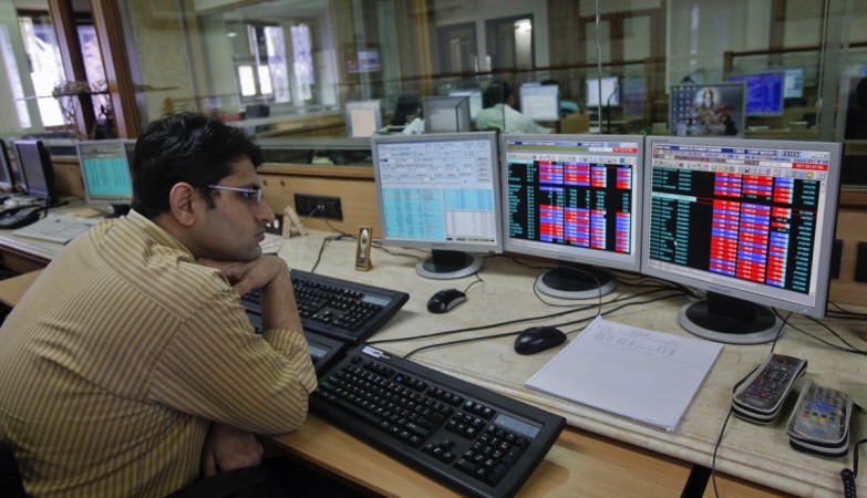 A broker monitors share prices at a brokerage firm in Mumbai August 9, 2011. stock market