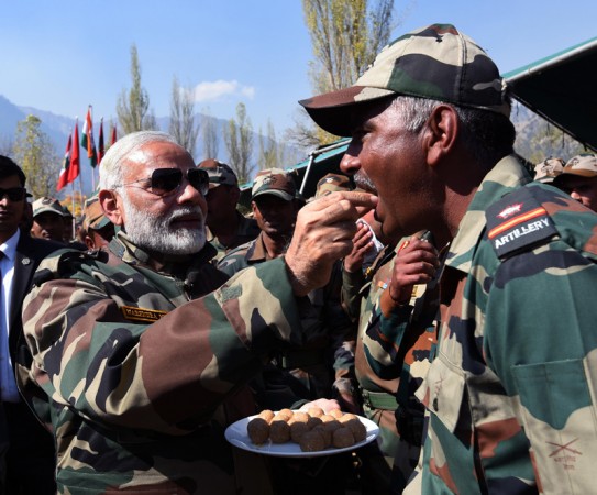The Prime Minister, Shri Narendra Modi celebrating Diwali with the jawans of Indian Army and BSF, in the Gurez Valley, near the Line of Control, in Jammu and Kashmir, on October 19, 2017. Modi army sweets