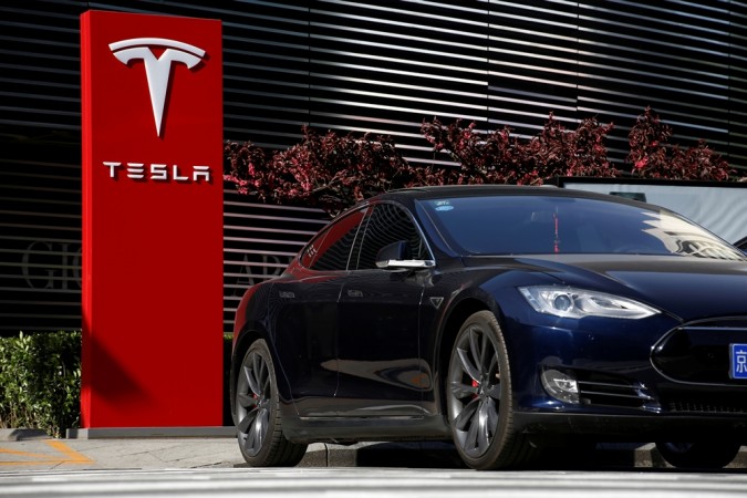 A Tesla car charges at a charging station in Beijing, China, April 18, 2017. Tesla Motors, Tesla China
