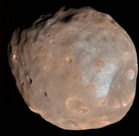 The High Resolution Imaging Science Experiment (HiRISE) camera on NASA's Mars Reconnaissance Orbiter took two images of the larger of Mars' two moons, Phobos, within 10 minutes of each other on March 23, 2008. This is the first. nasa, Phobos, solar wind, Martian moon,