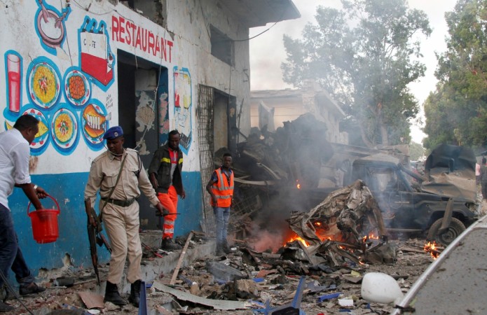 In picture: Somali security officers secure the scene of a suicide car bomb explosion, at the gate of Naso Hablod Two Hotel in Hamarweyne district of Mogadishu, Somalia October 28, 2017. Somalia blast