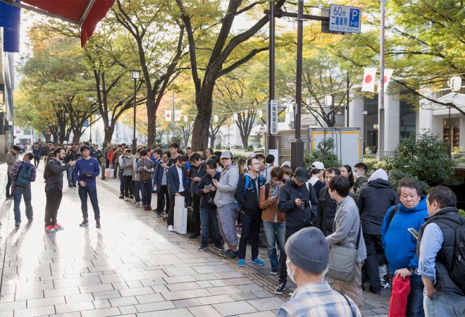 Customers queuing outside a store in Tokyo, Japan for iPhone X Customers queuing outside a store in Tokyo, Japan for iPhone X