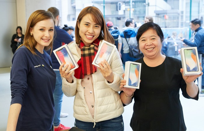 Customers with the new iPhone X in Sydney Customers with the new iPhone X in Sydney