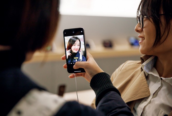 Customer with iPhone X in Shanghai, China Customer with iPhone X in Shanghai, China