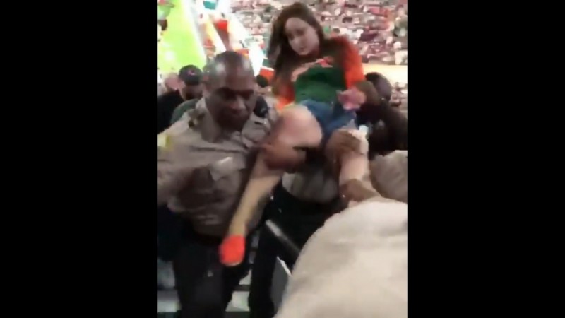 Video Watch Female Fan Punched Hard By Male Cop In College Football Game Ibtimes India